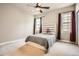 Bright bedroom featuring a modern headboard and large windows with modern curtains at 11602 Pine Canyon Dr, Parker, CO 80138