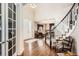 Elegant foyer with hardwood floors, staircase, and natural light, creating a welcoming entrance at 11602 Pine Canyon Dr, Parker, CO 80138