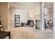Upstairs hallway featuring plush carpet and sophisticated decor, leading to various rooms in the house at 11602 Pine Canyon Dr, Parker, CO 80138