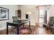 Inviting home office with hardwood floors, natural light, and elegant decor at 11602 Pine Canyon Dr, Parker, CO 80138