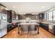 Gourmet kitchen boasts dark cabinetry, stainless steel appliances, and a central island, perfect for entertaining at 11602 Pine Canyon Dr, Parker, CO 80138