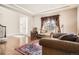 Inviting living room featuring hardwood floors, area rug, and a large window at 11602 Pine Canyon Dr, Parker, CO 80138