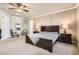 Comfortable main bedroom featuring two chairs, lamps, carpet, and a bed at 11602 Pine Canyon Dr, Parker, CO 80138