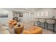 Finished basement with bar, living area, neutral carpet, and stylish decor with plenty of entertaining space at 2980 E 135Th Dr, Thornton, CO 80241