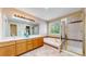 Bathroom features double sinks, soaking tub, and glass enclosed shower at 2980 E 135Th Dr, Thornton, CO 80241