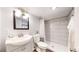 Updated bathroom with white vanity, shower featuring tiled walls and modern fixtures at 2980 E 135Th Dr, Thornton, CO 80241