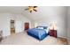 Bright primary bedroom with coordinated lamps, furnishings, and neutral carpet at 2980 E 135Th Dr, Thornton, CO 80241