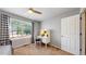 Bright bedroom with a ceiling fan, a large window with window treatments, and a white writing desk at 2980 E 135Th Dr, Thornton, CO 80241