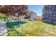 Charming home with well-manicured lawn, mature trees, and inviting front porch at 2980 E 135Th Dr, Thornton, CO 80241