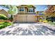 Two-story home featuring a two-car garage and a well-maintained front yard at 2980 E 135Th Dr, Thornton, CO 80241