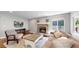 Comfortable living room boasts a cozy fireplace, plush seating, and natural light at 2980 E 135Th Dr, Thornton, CO 80241