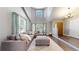 Bright living room with high ceilings, large windows, and a comfortable seating area at 2980 E 135Th Dr, Thornton, CO 80241