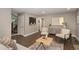 Spacious living room features wood floors, neutral paint, modern furniture and decor at 2980 E 135Th Dr, Thornton, CO 80241