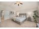 Serene main bedroom with vaulted ceilings, plush carpet, neutral paint, and stylish decor at 2980 E 135Th Dr, Thornton, CO 80241