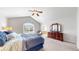 Spacious bedroom with vaulted ceilings, large window, and classic wooden furniture at 2980 E 135Th Dr, Thornton, CO 80241