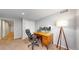Home office featuring a wood desk, dual monitors, and comfortable black office chair at 2980 E 135Th Dr, Thornton, CO 80241