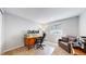This home office features a wooden desk, comfortable chair, and a day bed, ideal for working from home at 2980 E 135Th Dr, Thornton, CO 80241