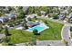 Aerial view of the community pool and playground area, surrounded by green space at 2980 E 135Th Dr, Thornton, CO 80241
