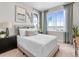 Bright bedroom with large window, mountain view, and stylish furnishings at 6244 N Lisbon St, Aurora, CO 80019