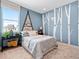 bedroom with blue walls, creative wall decor, and comfortable furnishings at 6244 N Lisbon St, Aurora, CO 80019