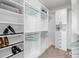 Spacious walk-in closet with custom shelving and ample storage space at 6244 N Lisbon St, Aurora, CO 80019
