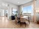 Cozy dining area featuring a round table, four chairs and a large window with lots of natural light at 6244 N Lisbon St, Aurora, CO 80019