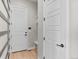Bright entryway featuring light wood floors and white doors at 6244 N Lisbon St, Aurora, CO 80019