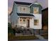 Charming two-story home with a cozy front porch and professionally landscaped yard at 6244 N Lisbon St, Aurora, CO 80019