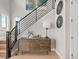 Stylish foyer features wood floors, modern staircase, and decorative accents at 6244 N Lisbon St, Aurora, CO 80019