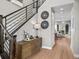 Beautiful foyer with wood floors, open staircase, and stylish decor at 6244 N Lisbon St, Aurora, CO 80019