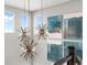 Bright hallway featuring contemporary lighting fixtures and decorative artwork on the wall at 6244 N Lisbon St, Aurora, CO 80019
