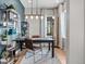 Well-lit home office with stylish furniture, bookshelves, and large window at 6244 N Lisbon St, Aurora, CO 80019
