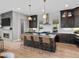 Modern kitchen with stainless steel appliances, kitchen island, and pendant lights at 6244 N Lisbon St, Aurora, CO 80019