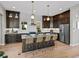 Gourmet kitchen with large island, modern appliances, and stylish finishes at 6244 N Lisbon St, Aurora, CO 80019