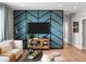 Stylish living room showcasing a custom accent wall, modern decor, and ample natural light at 6244 N Lisbon St, Aurora, CO 80019