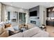 Relaxing living room featuring a modern fireplace and access to an outdoor patio at 6244 N Lisbon St, Aurora, CO 80019