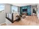 Upper-level living room featuring stylish decor, a modern sofa, and ample natural light at 6244 N Lisbon St, Aurora, CO 80019