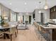Open-concept living space with modern kitchen, dining area, and comfortable seating at 6244 N Lisbon St, Aurora, CO 80019