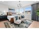 Bright main bedroom with modern furniture, cozy seating, and ample natural light at 6244 N Lisbon St, Aurora, CO 80019
