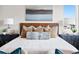 Close-up of a stylish main bedroom featuring designer bedding and decorative accents at 6244 N Lisbon St, Aurora, CO 80019