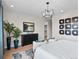 Serene main bedroom with modern decor, artwork, and plush seating creating a relaxing retreat at 6244 N Lisbon St, Aurora, CO 80019