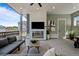 Relaxing covered patio with a modern fireplace and stylish decor at 6244 N Lisbon St, Aurora, CO 80019