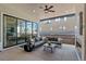 Covered patio featuring sliding glass doors and an outdoor fireplace at 6244 N Lisbon St, Aurora, CO 80019