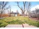 Spacious backyard features a well-maintained lawn and convenient storage shed at 1232 Wabash St, Denver, CO 80220