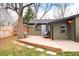 Charming backyard deck with patio seating and mature shade tree at 1232 Wabash St, Denver, CO 80220