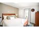Inviting bedroom with wood accent wall, natural light, and stylish decor at 1232 Wabash St, Denver, CO 80220