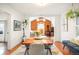 Inviting dining room featuring natural light, wood floors, table for four, and stylish decor at 1232 Wabash St, Denver, CO 80220