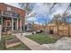 Private backyard featuring a well-maintained lawn, patio, and garden beds ideal for outdoor entertaining at 300 S Lincoln St, Denver, CO 80209