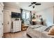 Bright bedroom with ceiling fan, large window, and ample space for relaxing and resting at 300 S Lincoln St, Denver, CO 80209