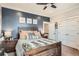 Inviting bedroom features a wood bed frame, decorative pillows, and textured blanket at 300 S Lincoln St, Denver, CO 80209